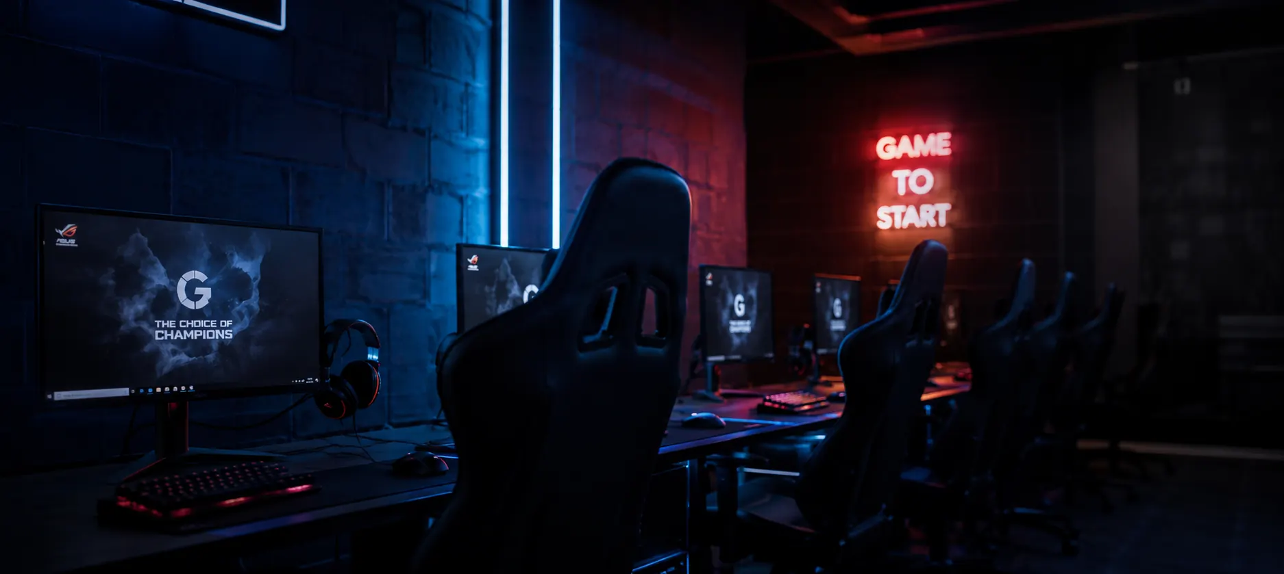 Rows of gaming stations in a dark esports room with neon signage