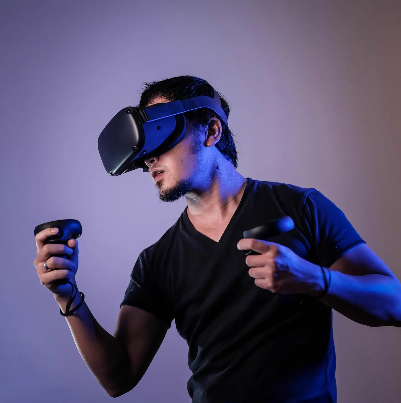 Player wearing a VR headset holding motion controllers